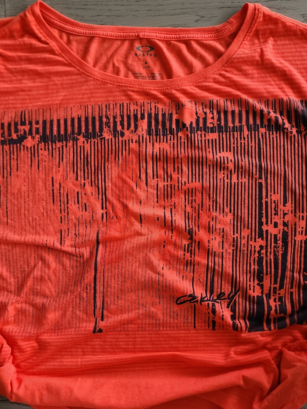 “Y2K Oakley neon coral graphic athletic tee | sporty mcbling athleisure top”